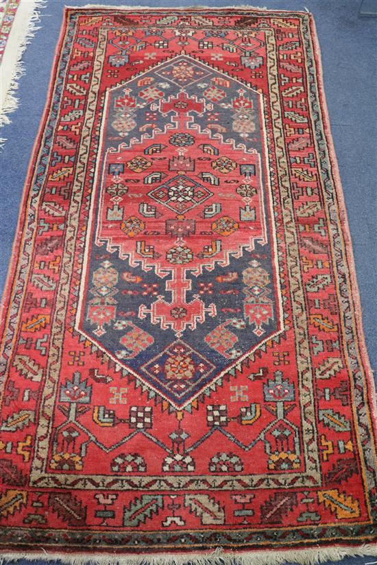 A Caucasian red ground rug, 6ft 7in. x 3ft 6in.